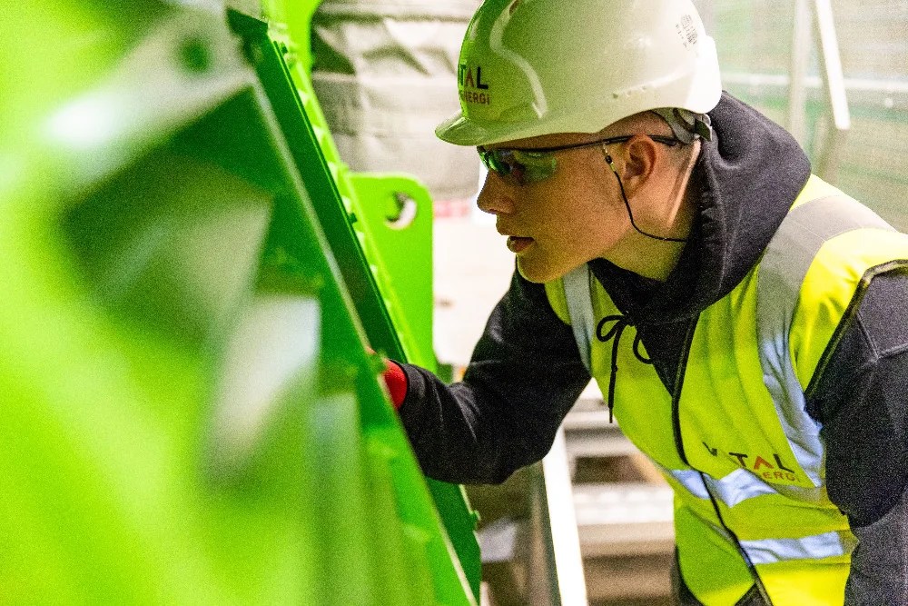 Maintenance technician inspecting industrial equipment