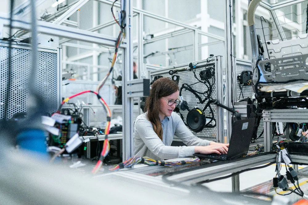Engineer working at an industrial production workstation